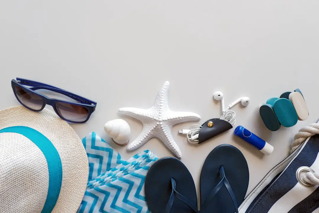 Beach essentials are laid out on a surface.