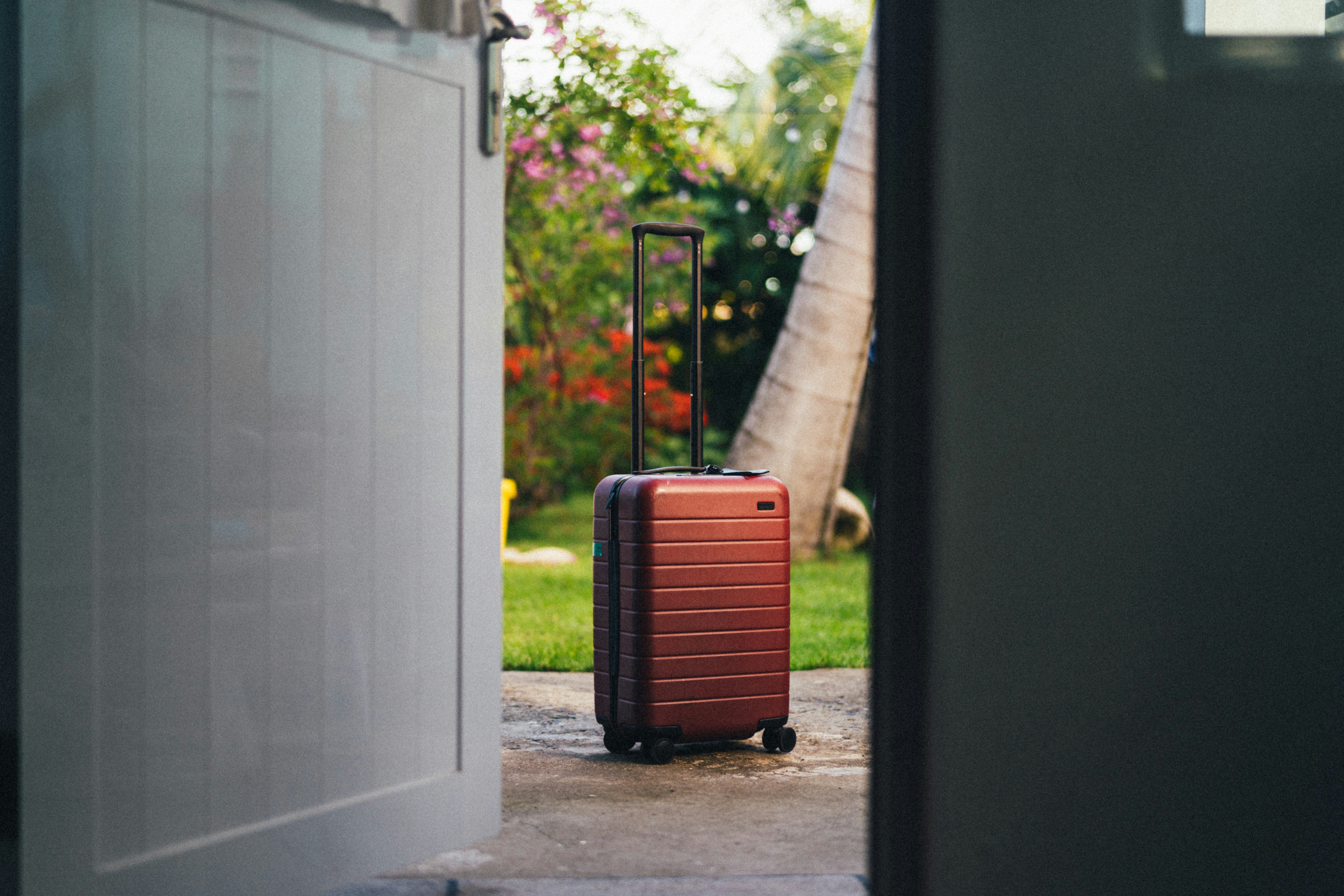 red and black luggage bag